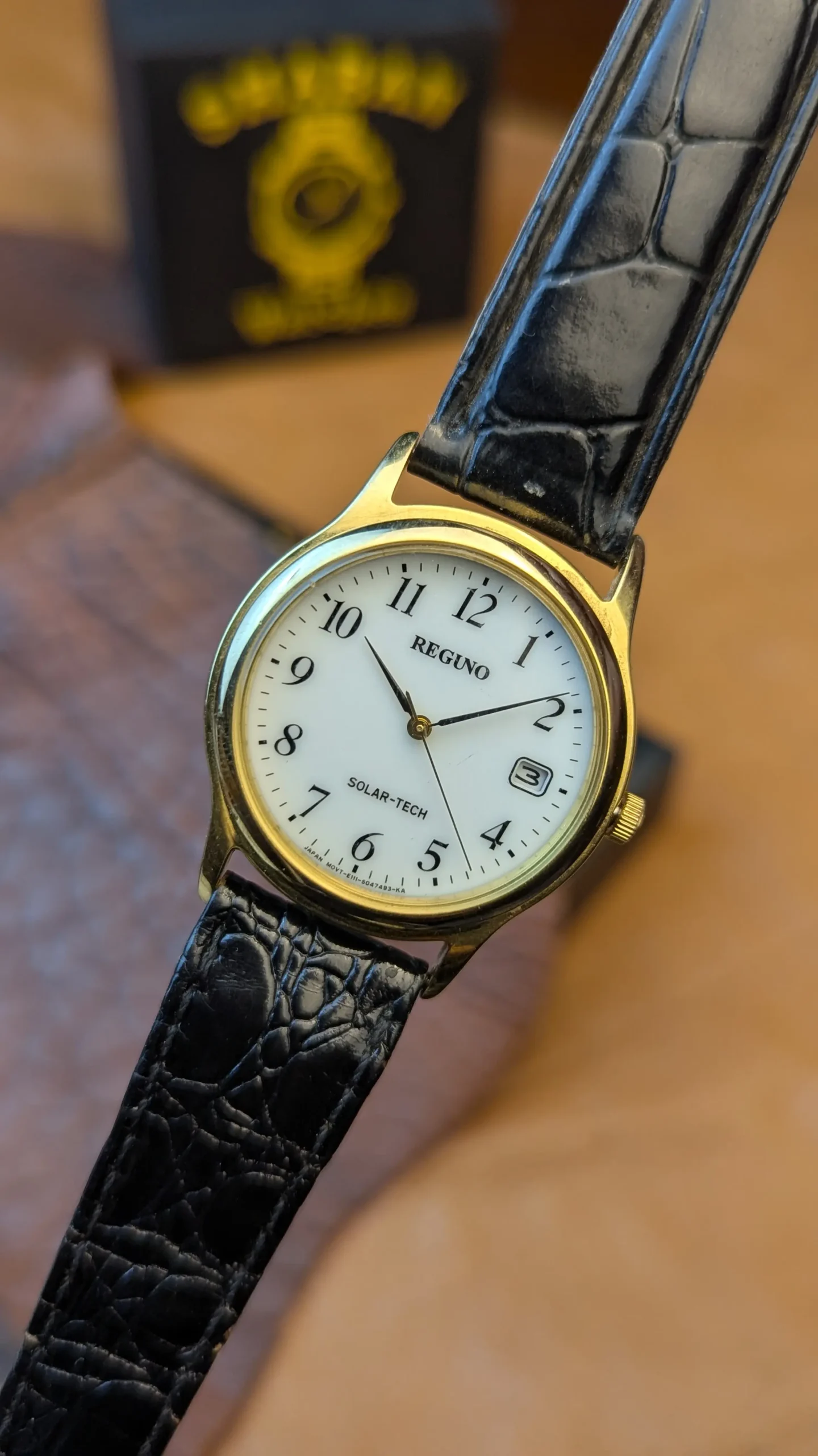 Reguno Solar-Tech Gold Tone Dress Watch – Classic White Dial with Date Window
