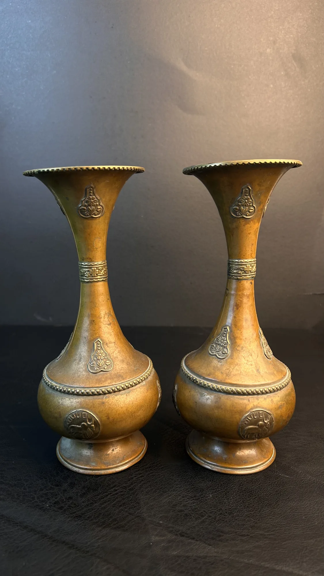 Pair of Brass Vases with Embossed Floral and Animal Motifs