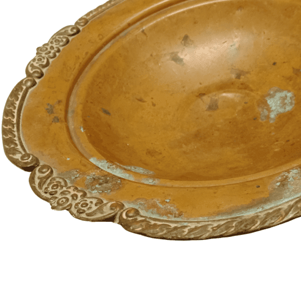 Ornate antique copper bowl with natural patina