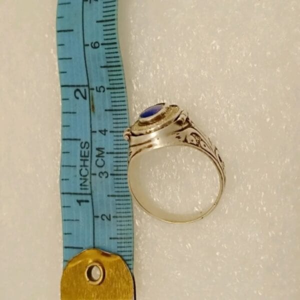 Antique-style ring with secret compartment opened