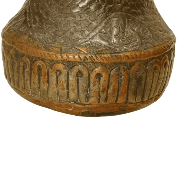 Vintage copper pot featuring dragon/snake carvings.