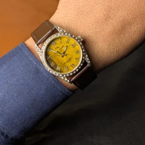 Detailed view of vintage Gianni Accardi watch dial with textured golden finish