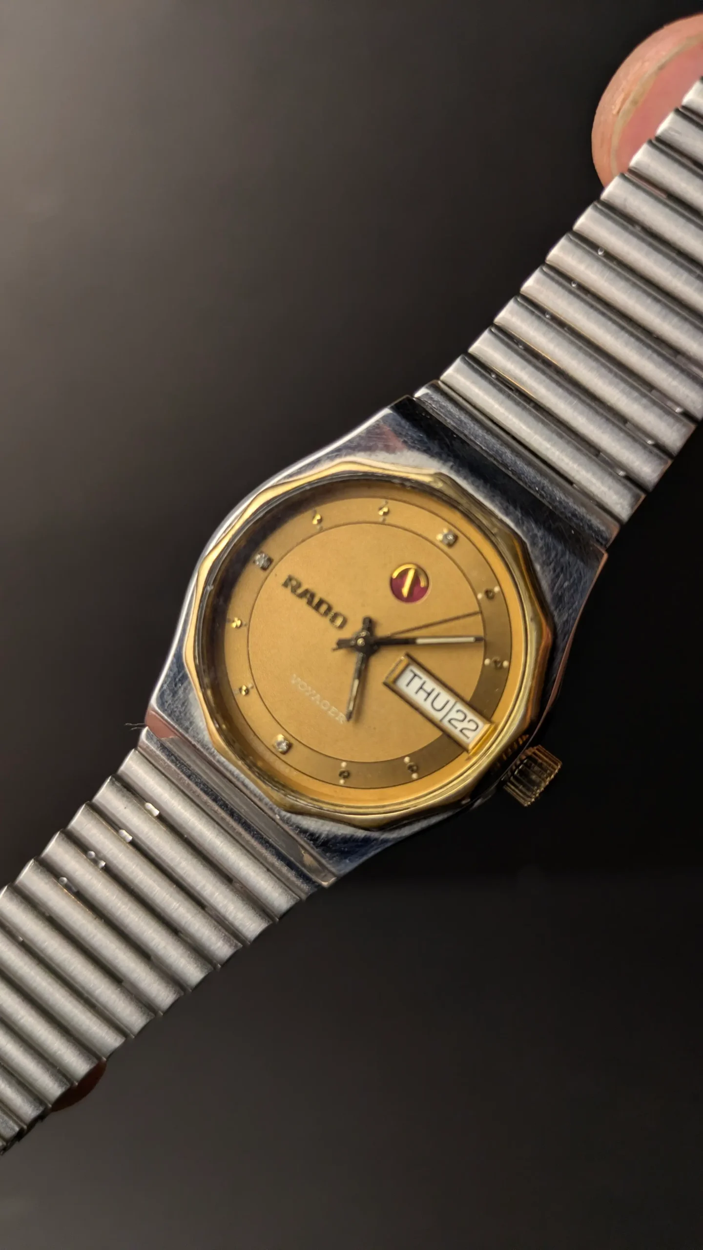 Vintage RADO Voyager automatic watch with gold dial and stainless steel bracelet