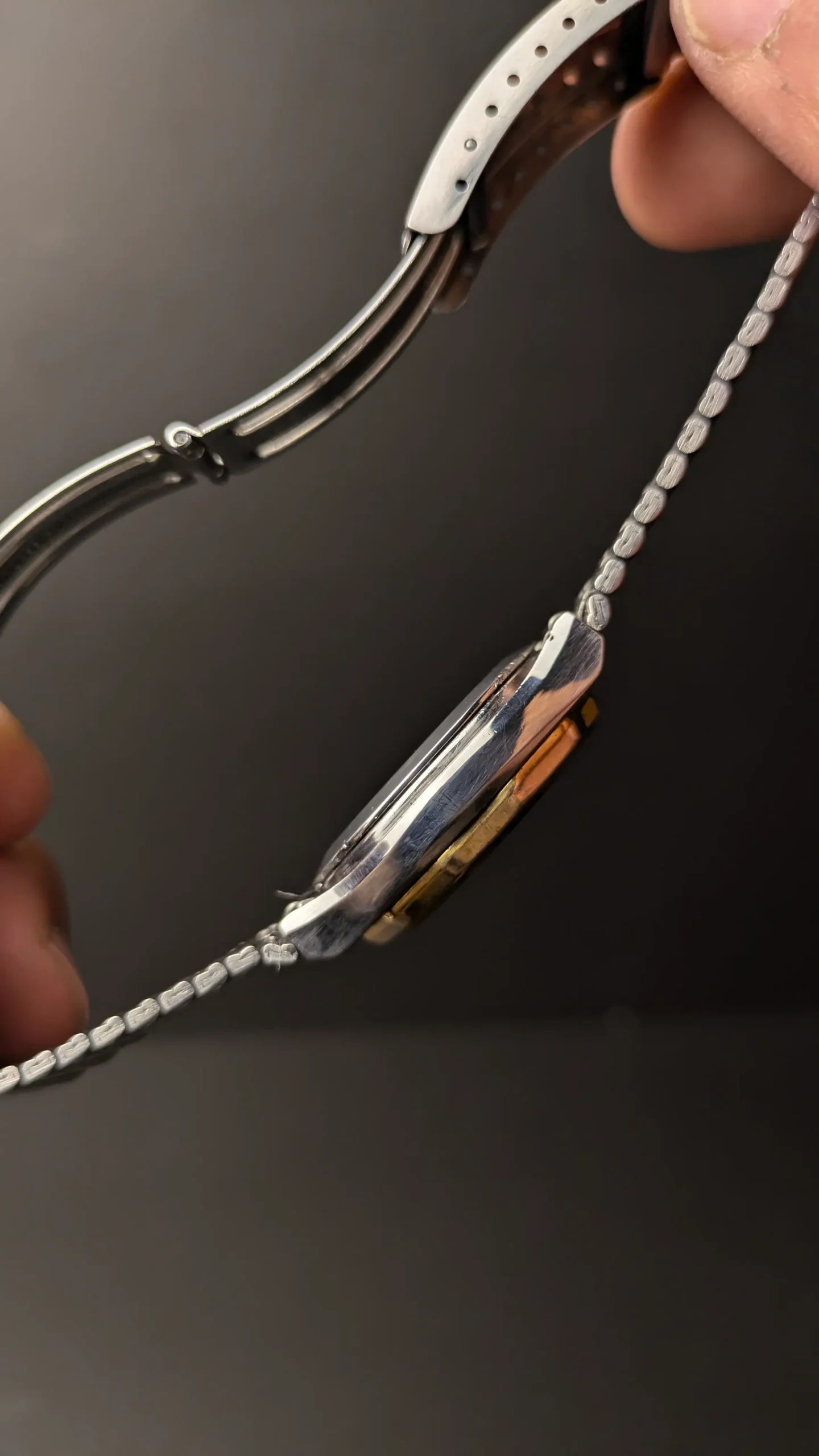 Side view of classic RADO style automatic watch showing polished case edges
