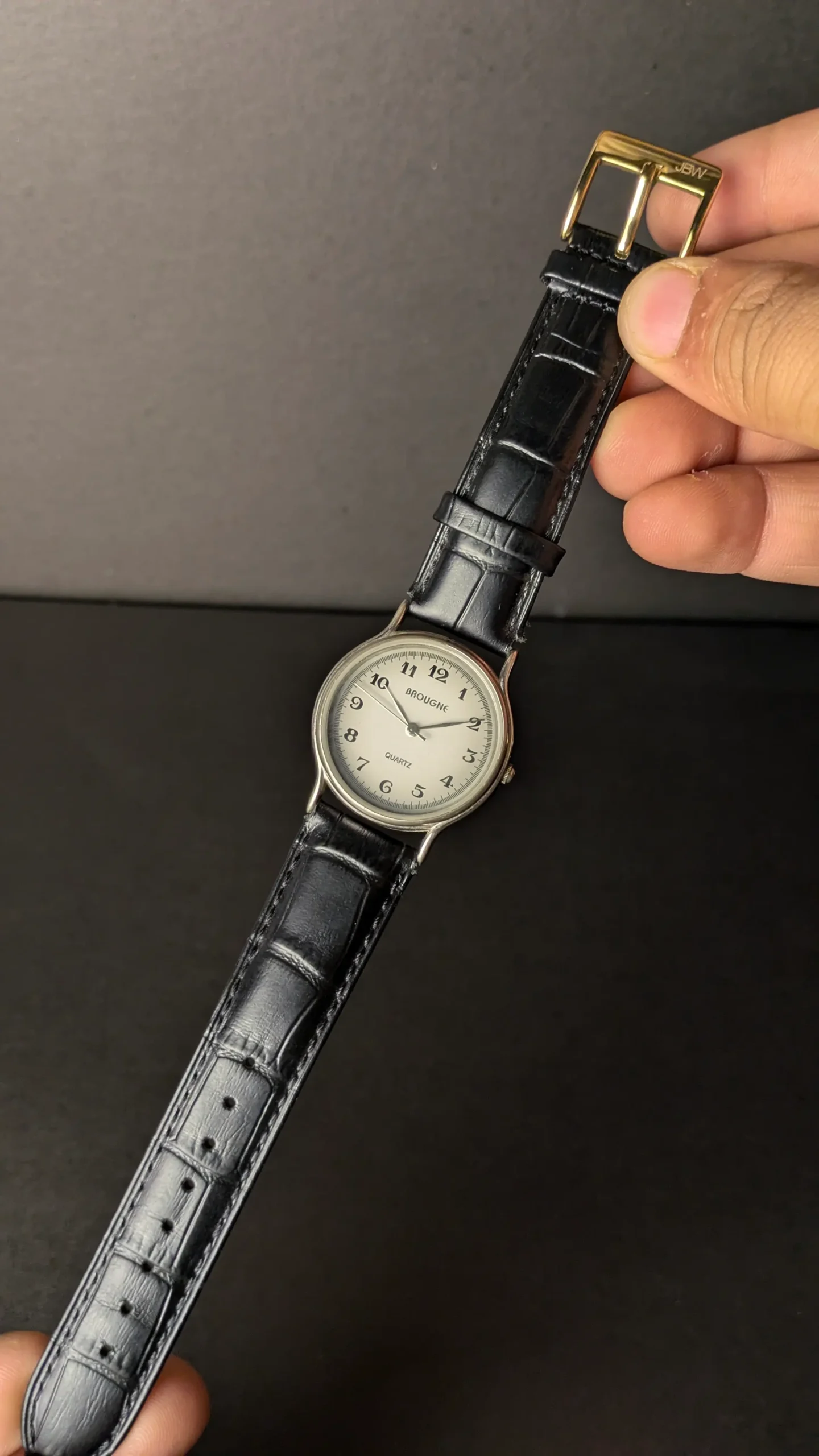 White dial BROUGNE wristwatch close-up
