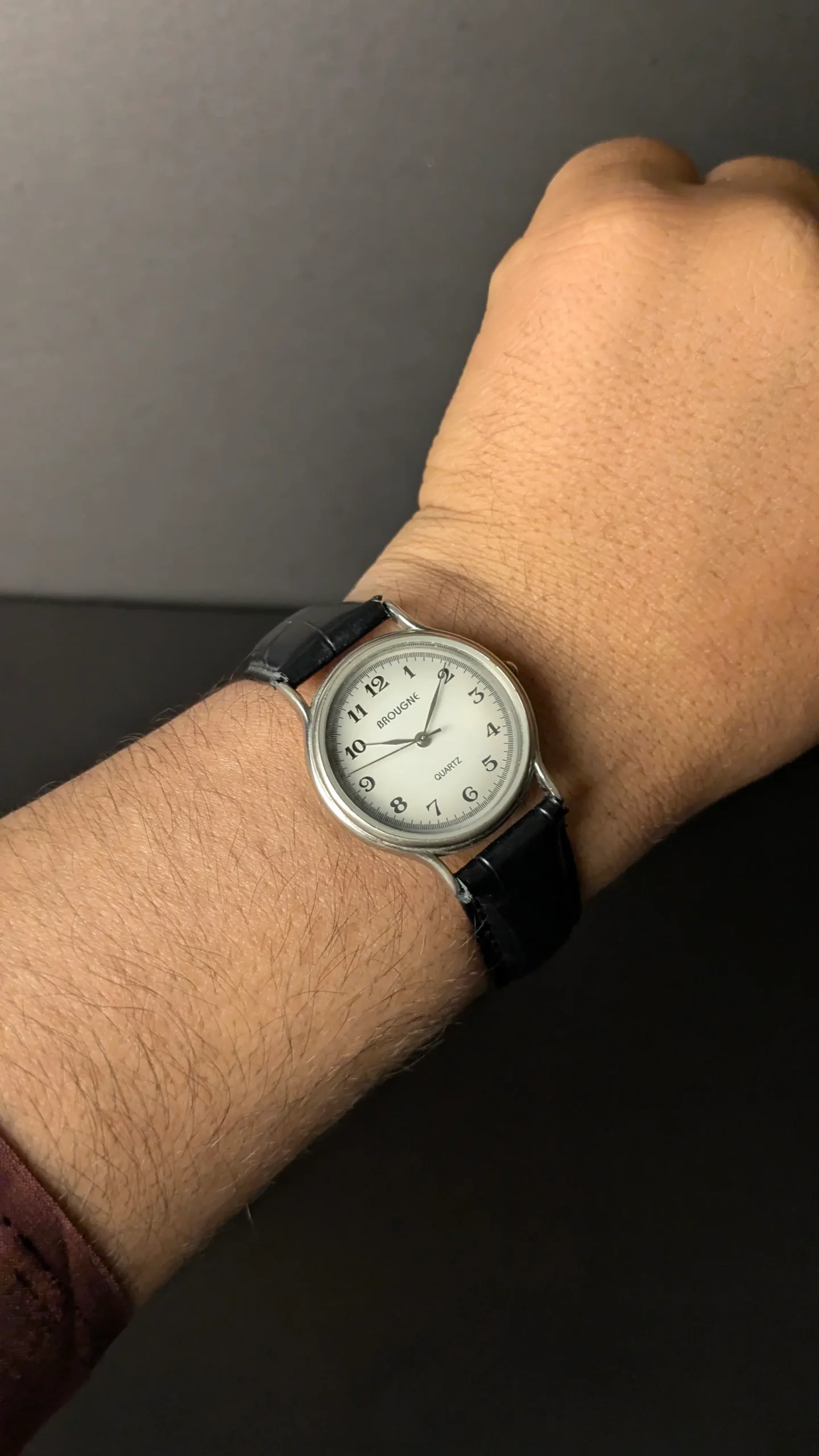 Black leather strap BROUGNE watch on wrist
