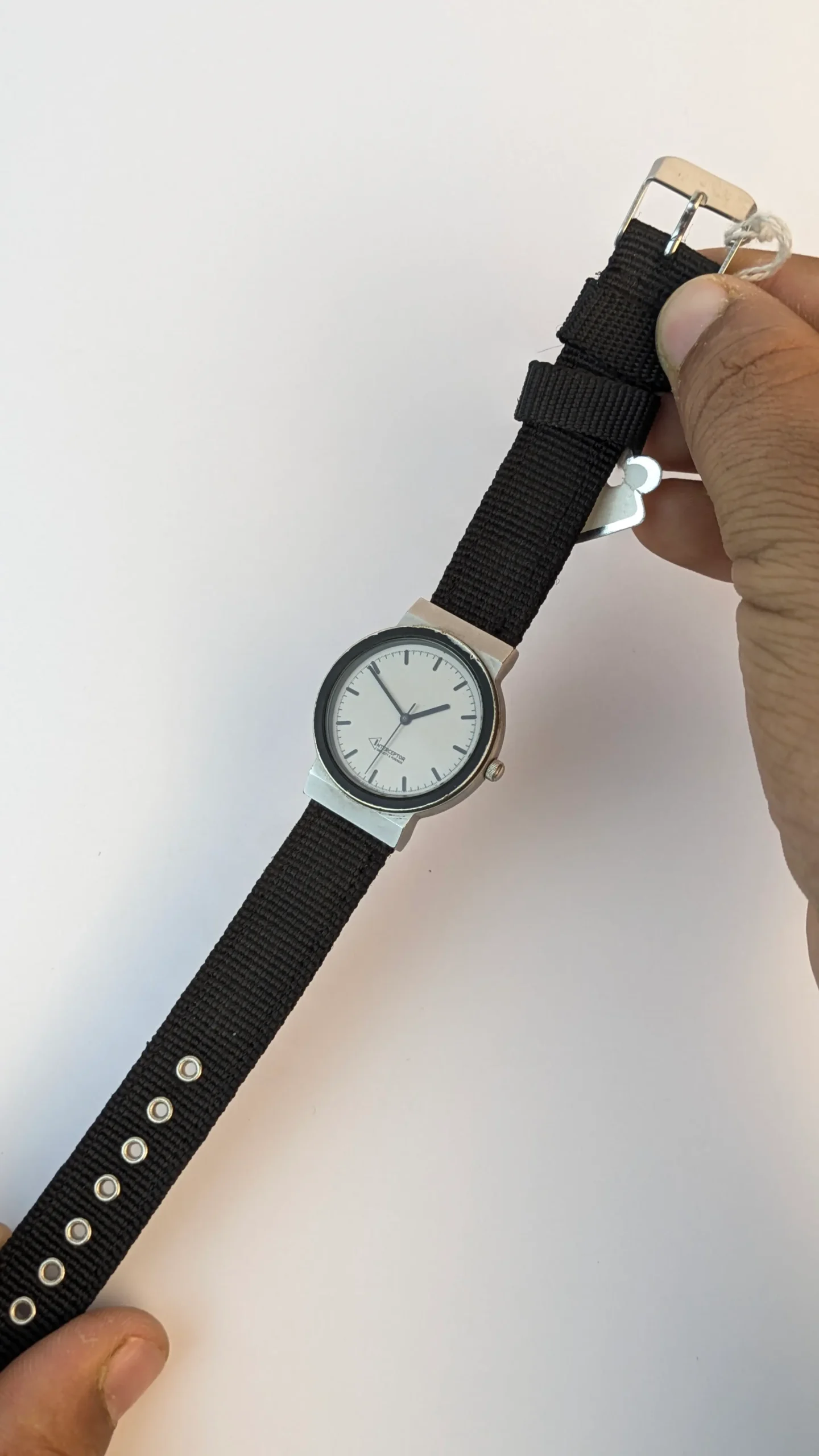 Vintage white dial watch with black nylon strap