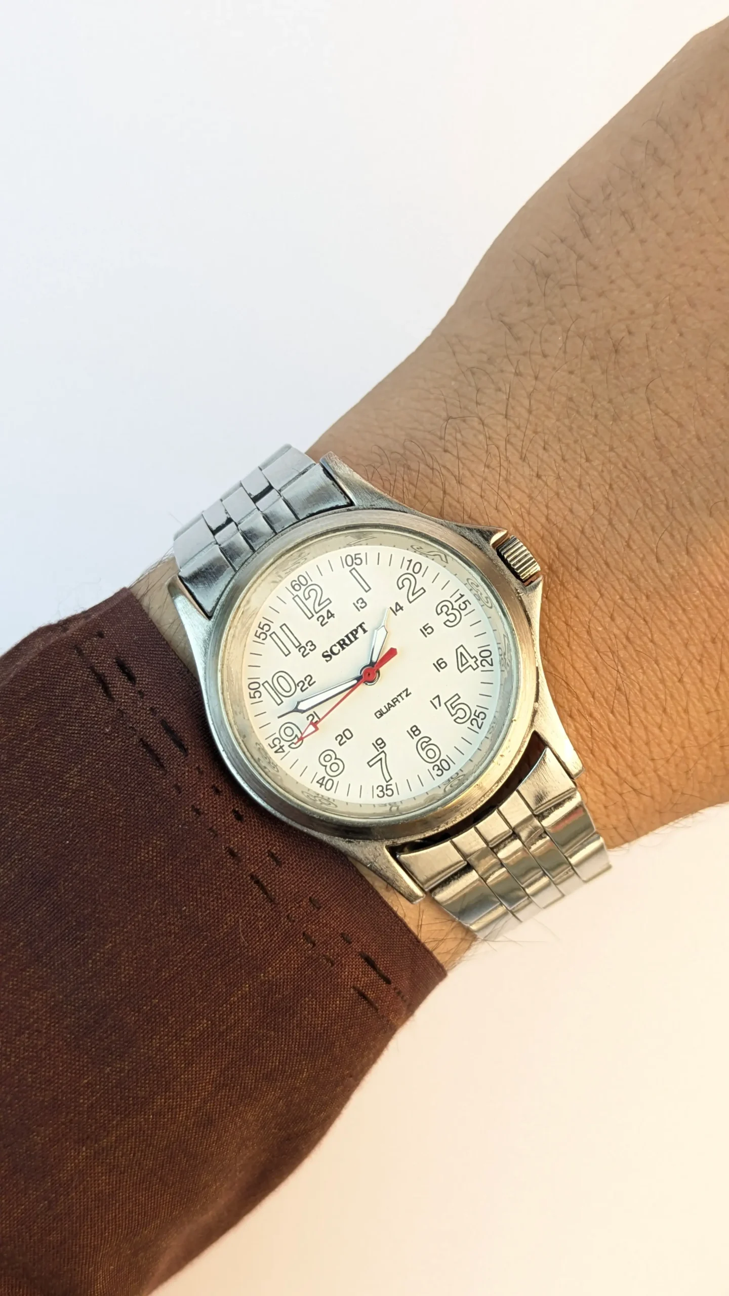 Vintage Script Quartz stainless steel wristwatch close-up