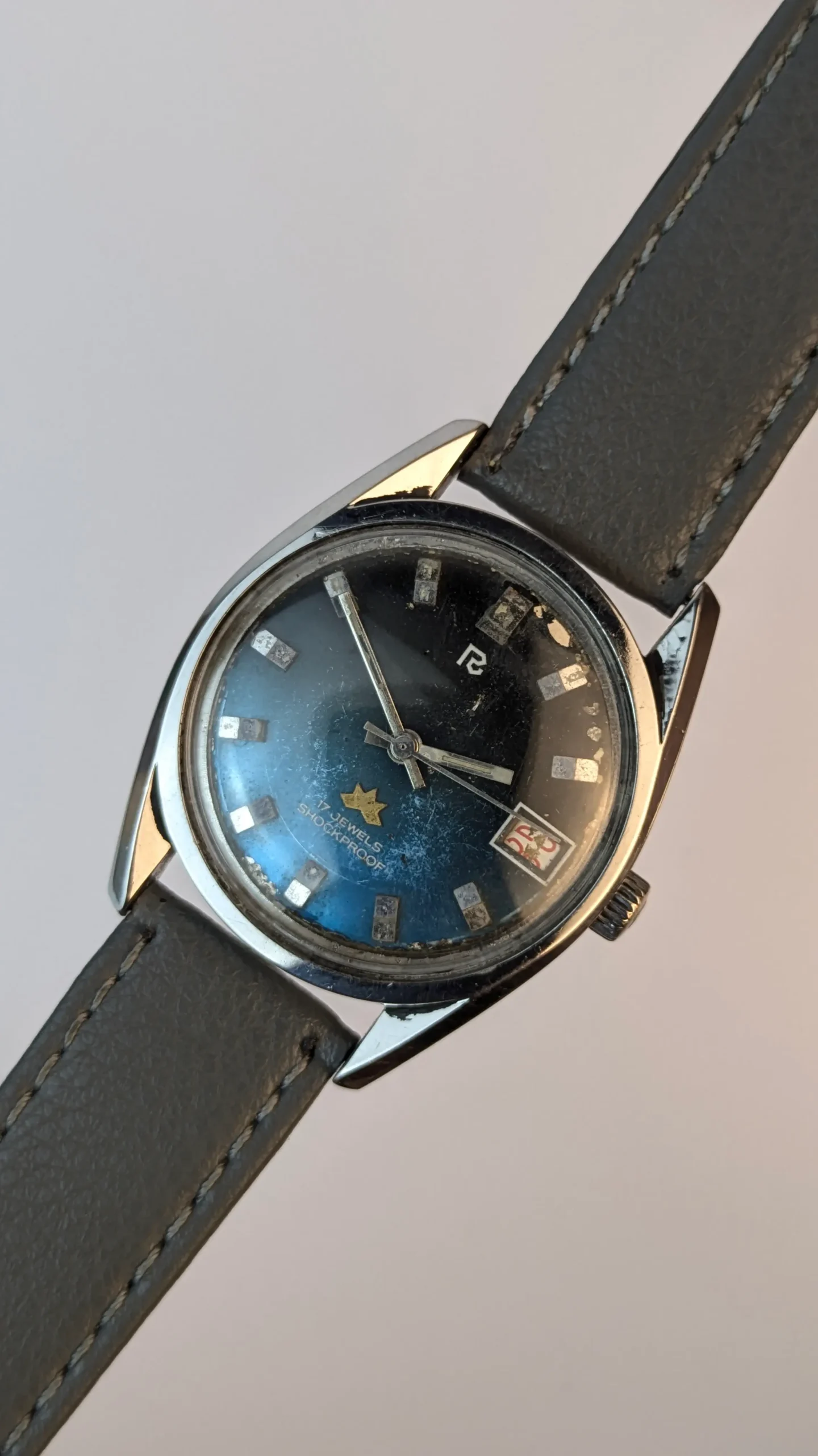 Full front view of vintage blue dial watch