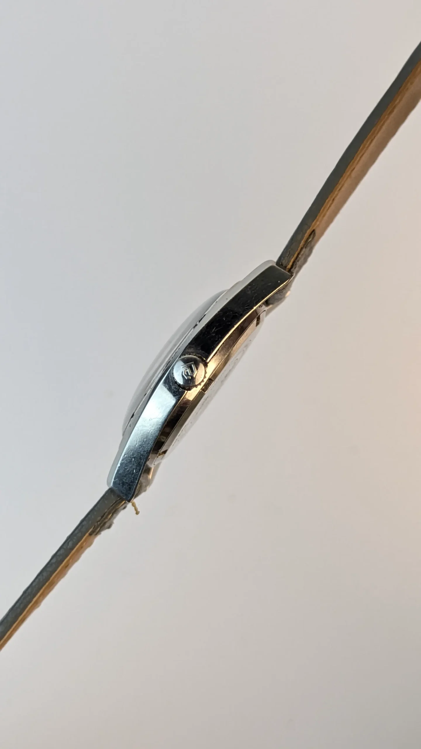 Side profile of stainless steel vintage wristwatch