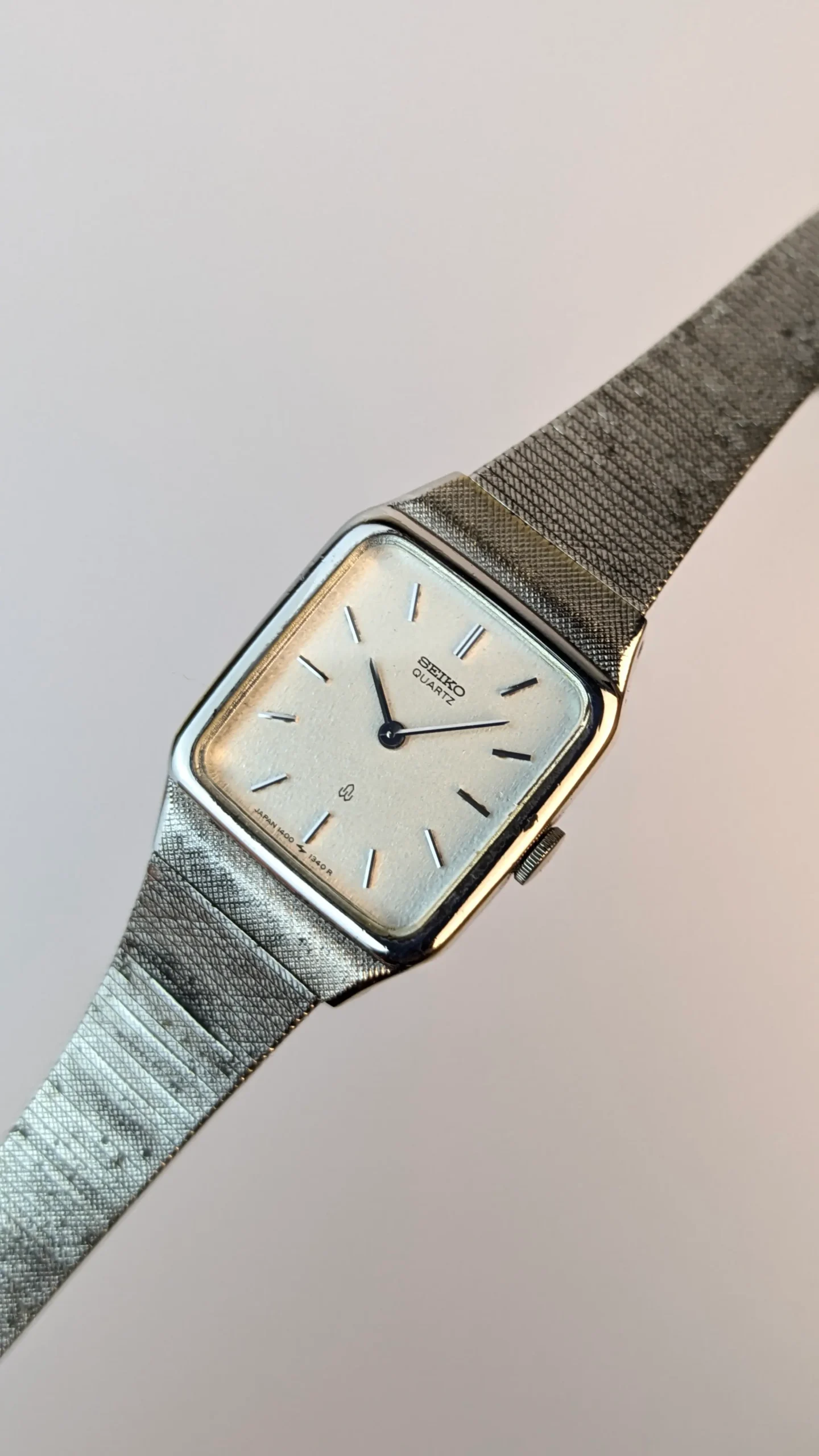 1970s Seiko Quartz square case dress watch with original integrated woven mesh bracelet silvered dial made in Japan