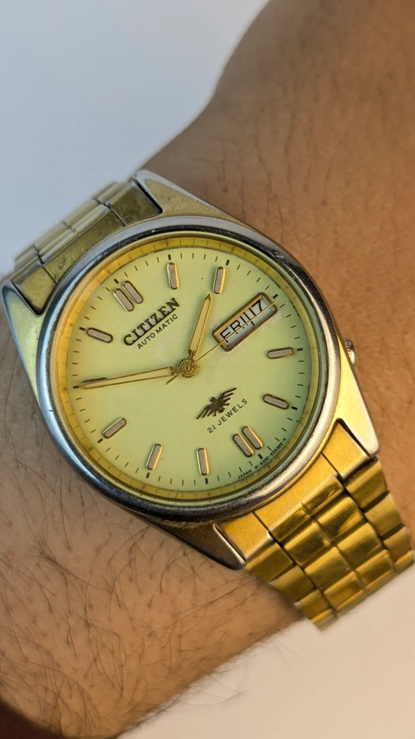 Vintage Citizen Automatic 21 Jewels watch on wrist showing champagne yellow dial day-date window and gold tone bracelet
