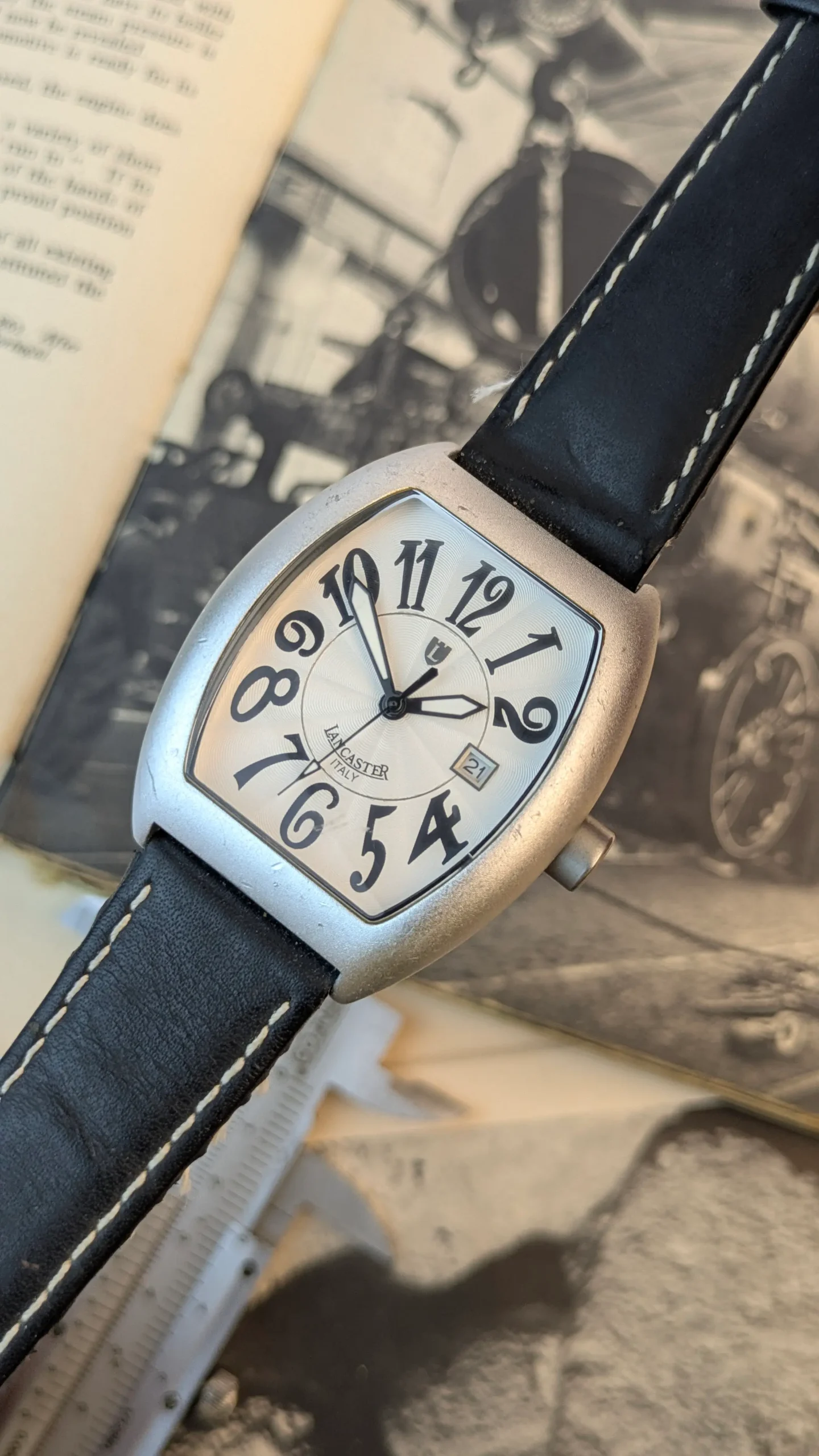 Angled front view of Lancaster Italy silver dial watch with oversized Arabic numerals