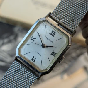 Close-up of Citizen Playmate dial with Roman numeral markers.