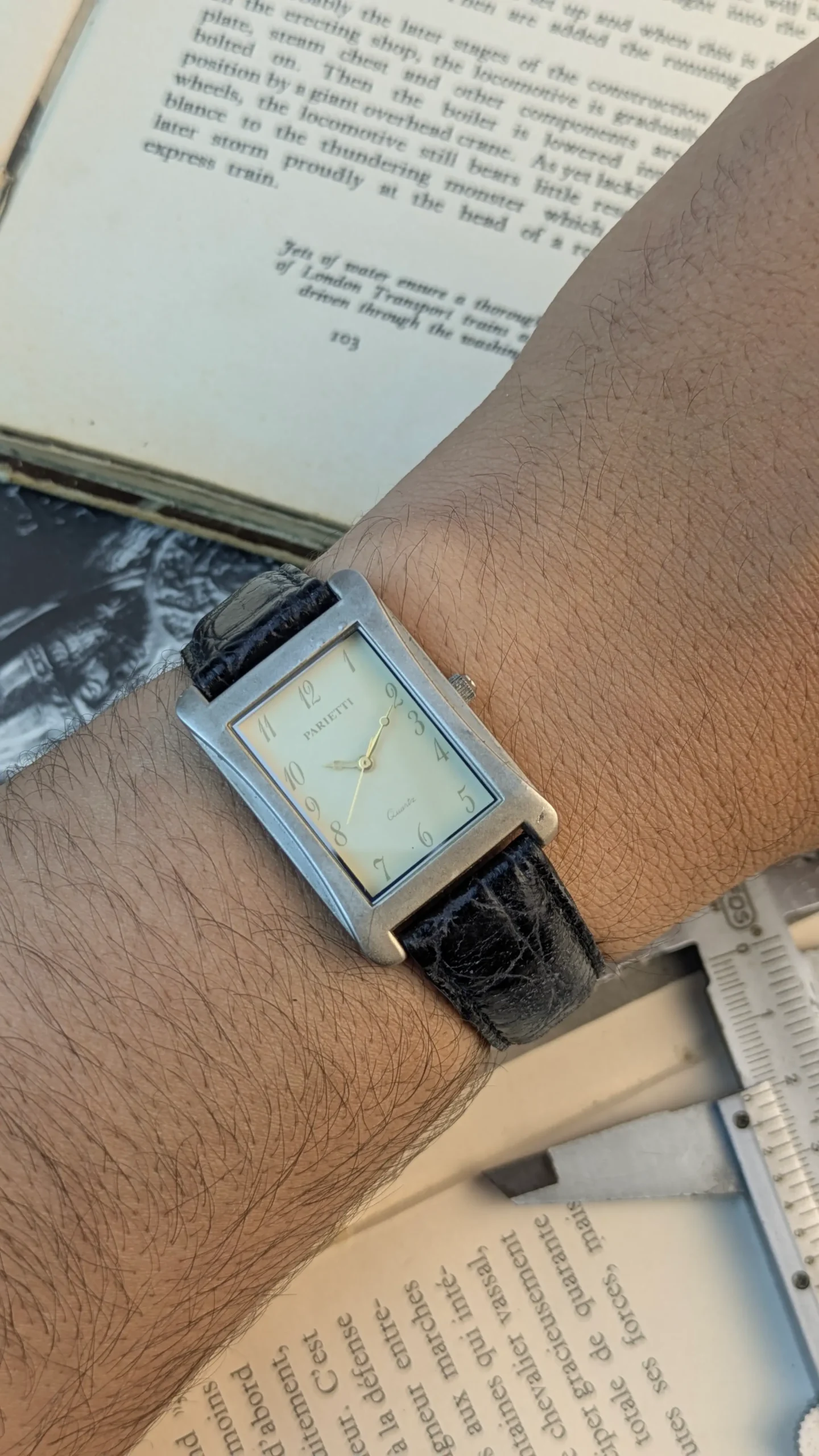 Parietti quartz watch worn on wrist showing rectangular case.