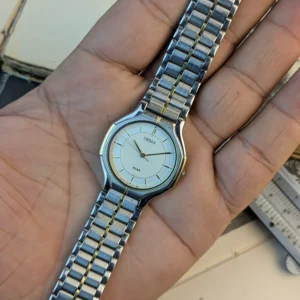 Vintage ALBA Urban watch displayed in hand showing full bracelet.