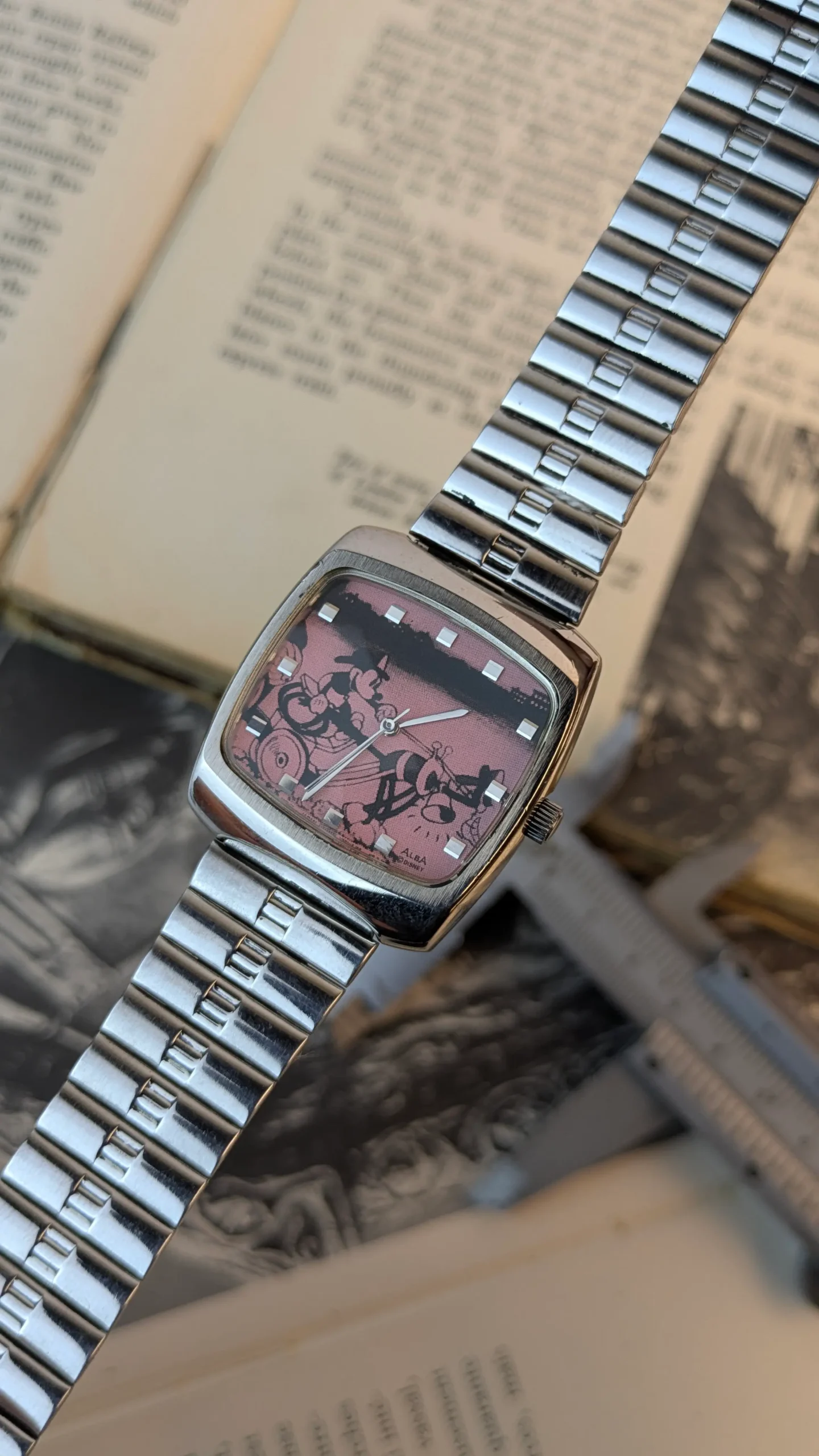 Front view of vintage ALBA Disney watch with pink Mickey Mouse dial.