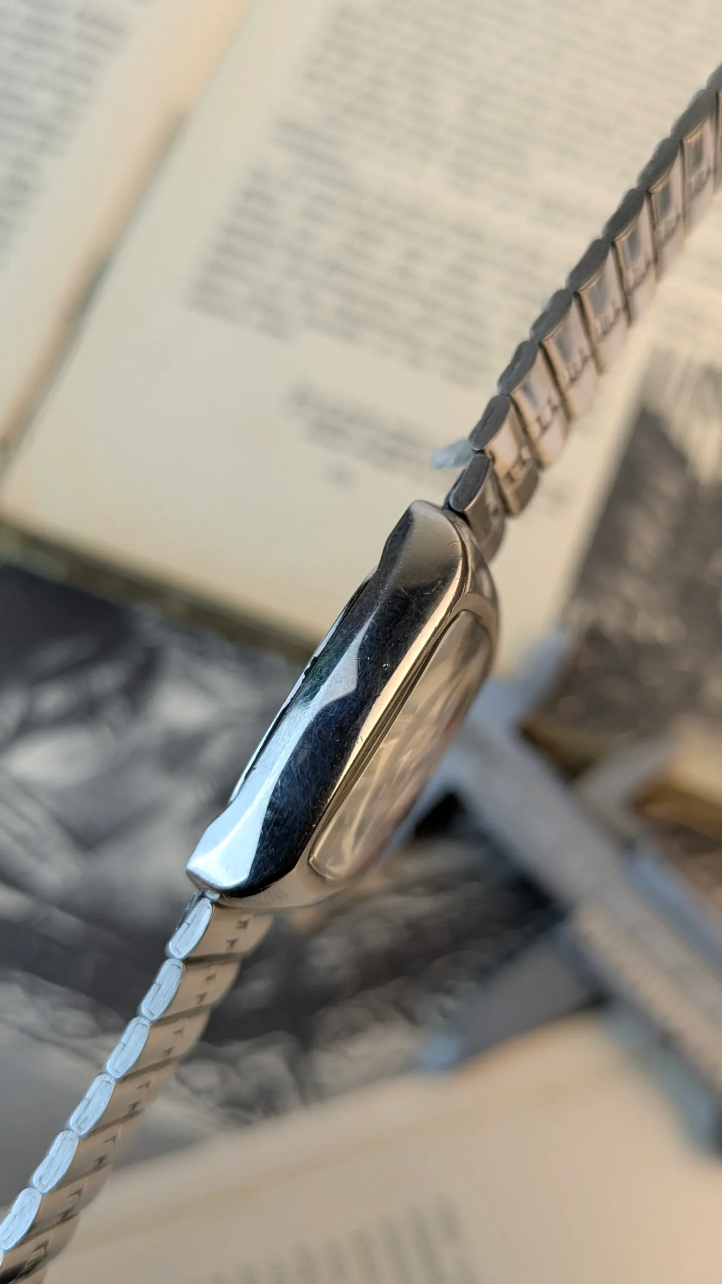 Side profile of vintage ALBA Disney watch showing stainless steel case.