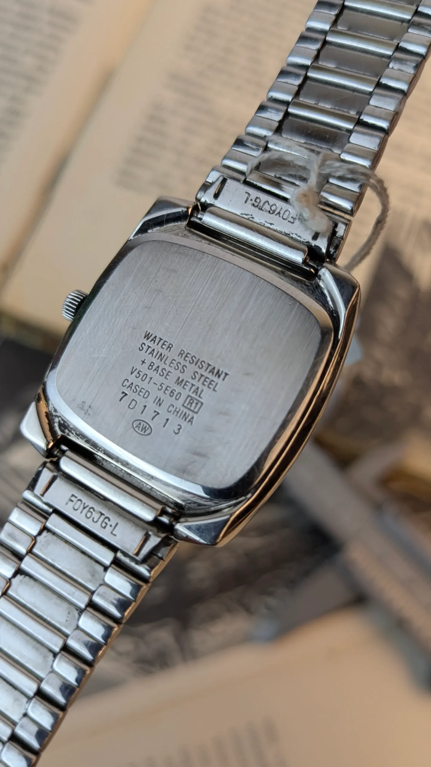 Back case of vintage ALBA Disney watch with model markings.