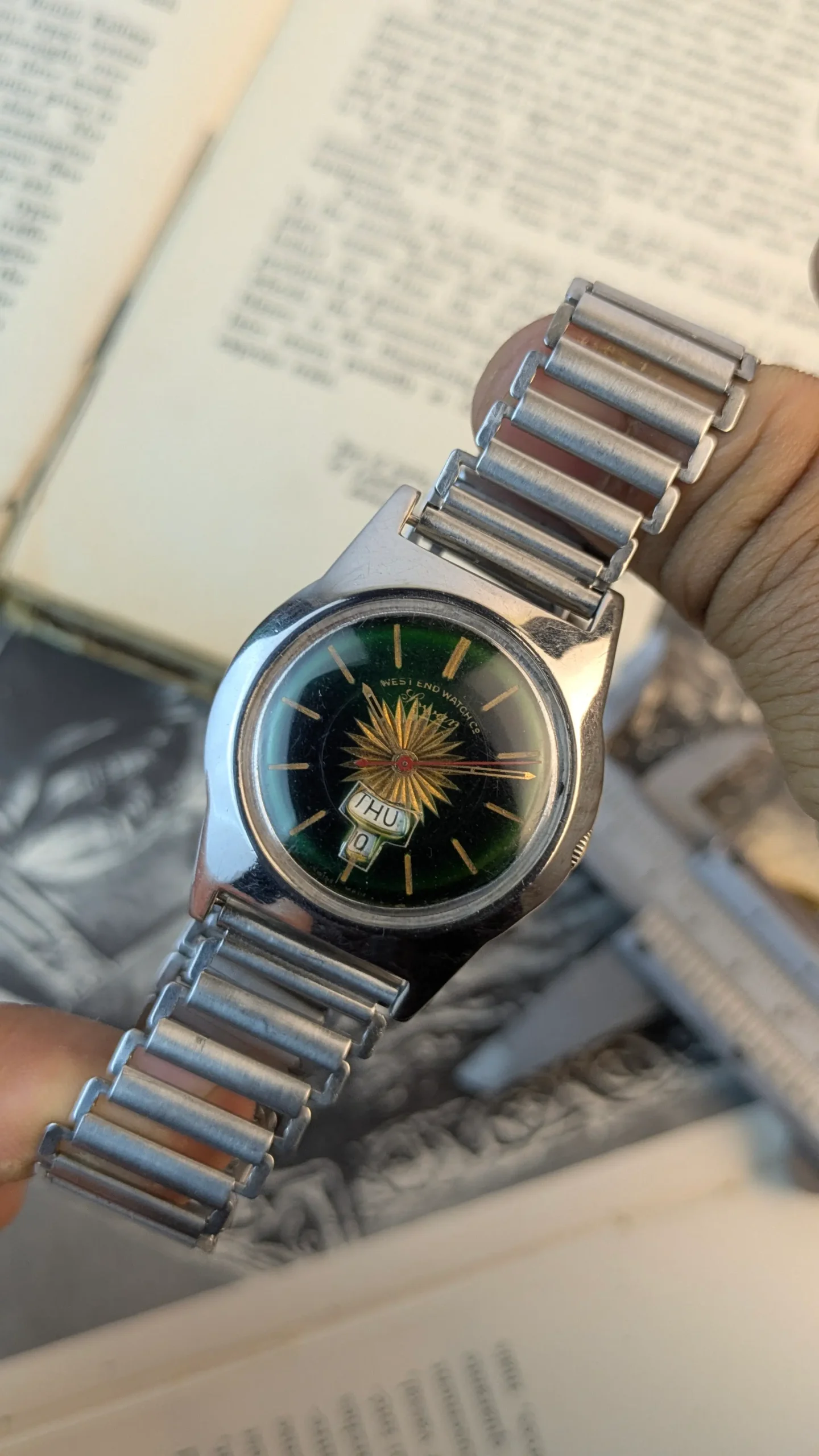 Vintage West End Watch Co with green dial and gold sunburst design.