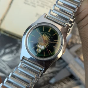 Vintage West End Watch side profile showing stainless steel case and crown.