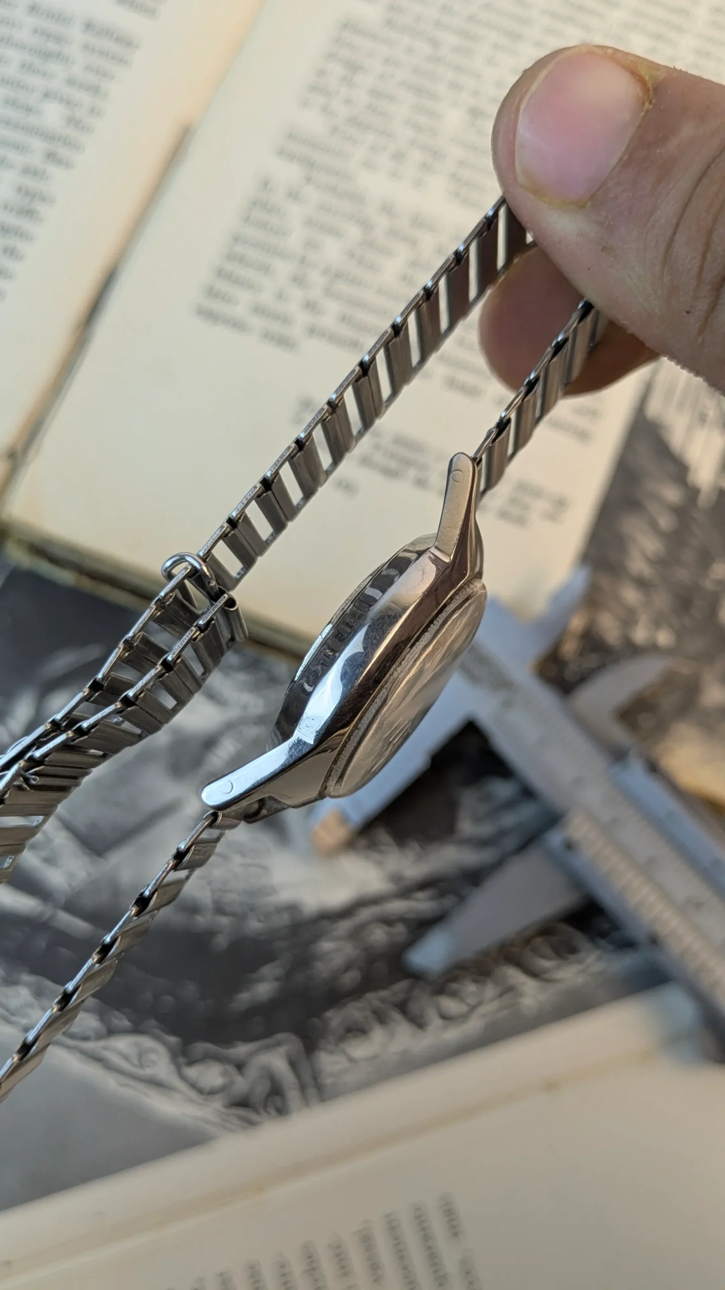 Side profile of vintage West End Watch stainless steel case and bracelet.