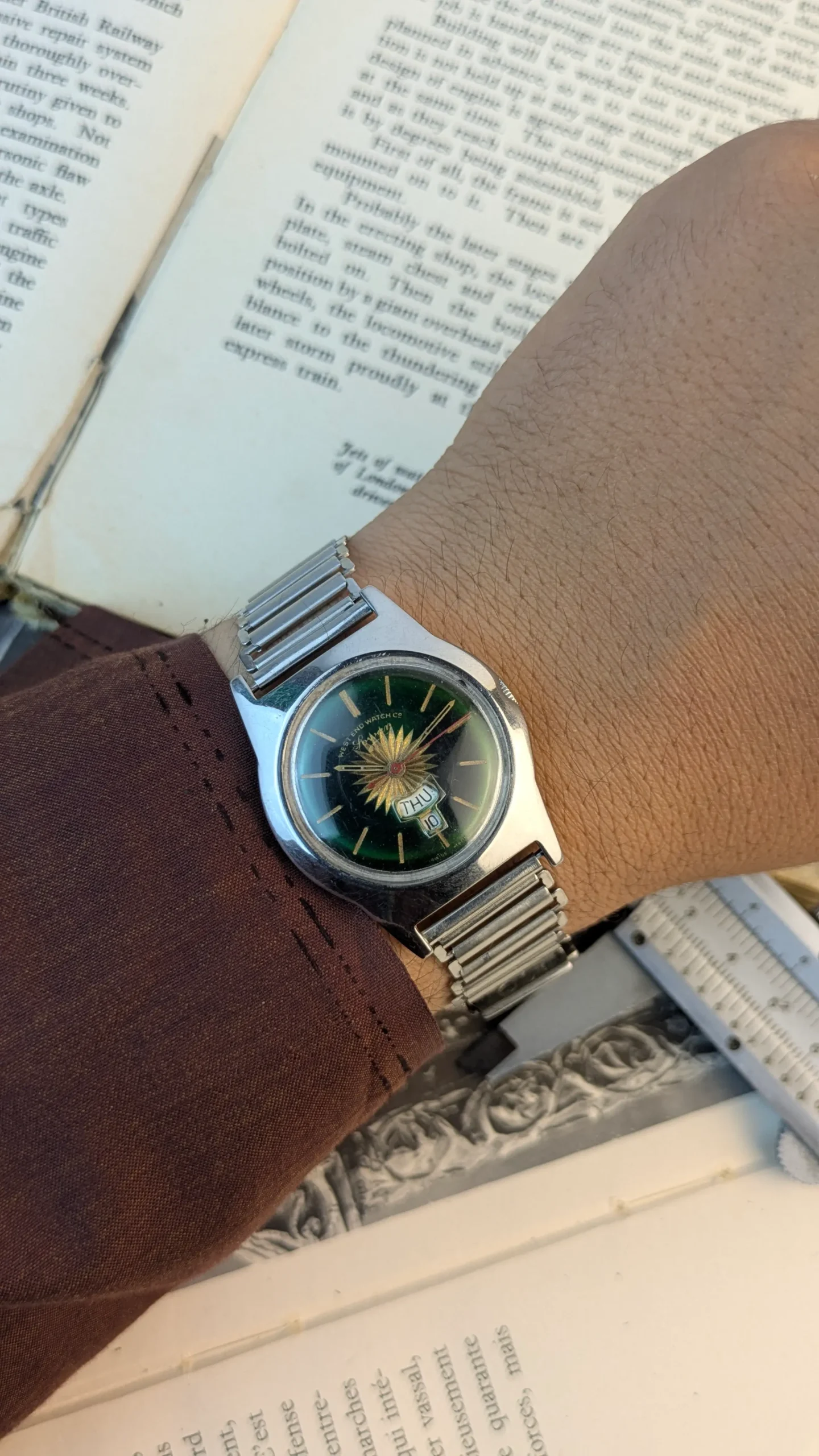 Vintage West End Watch worn on wrist with expandable stainless steel bracelet.
