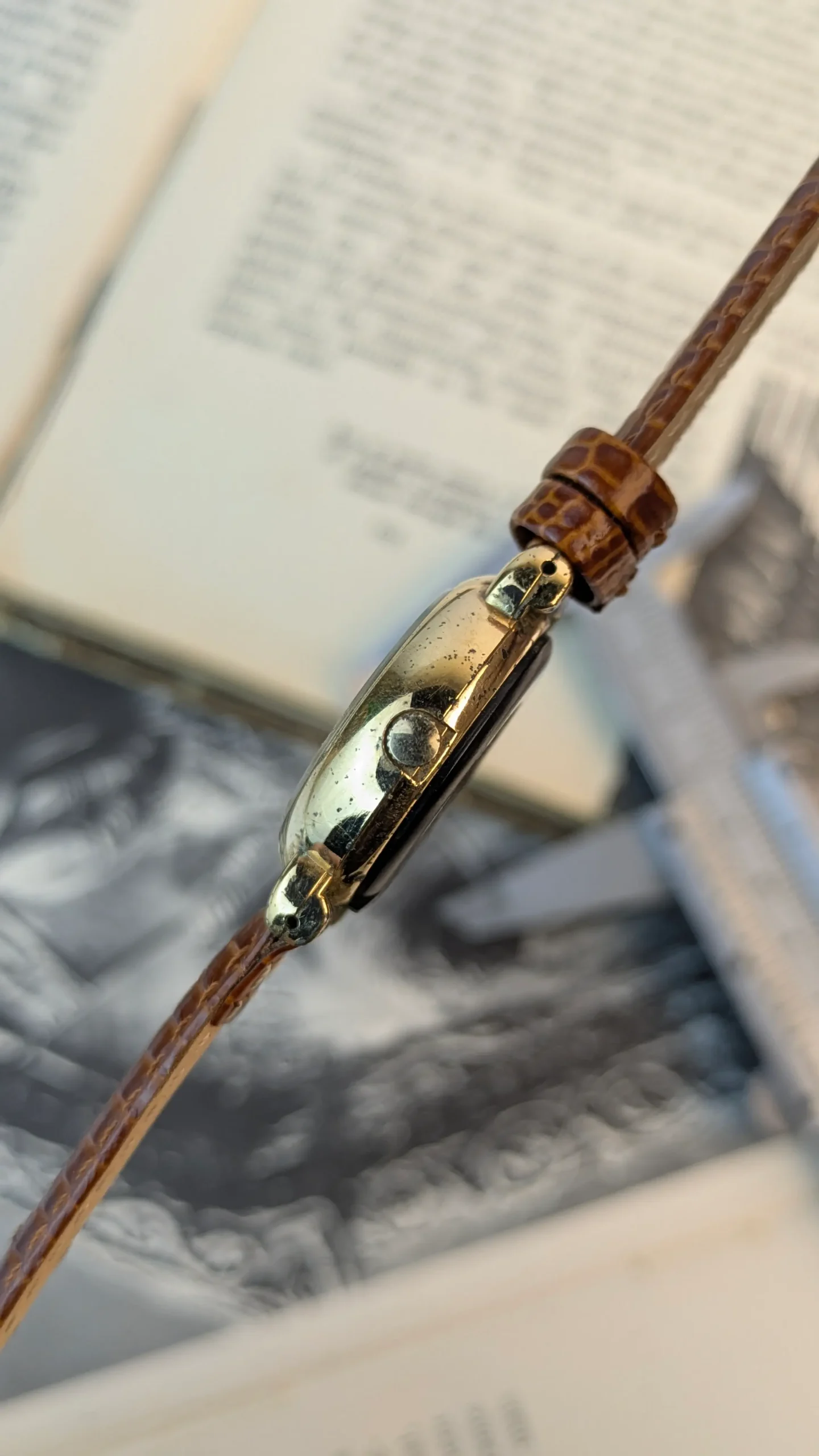 Side view of vintage ALBA quartz watch displaying crown and case wear.