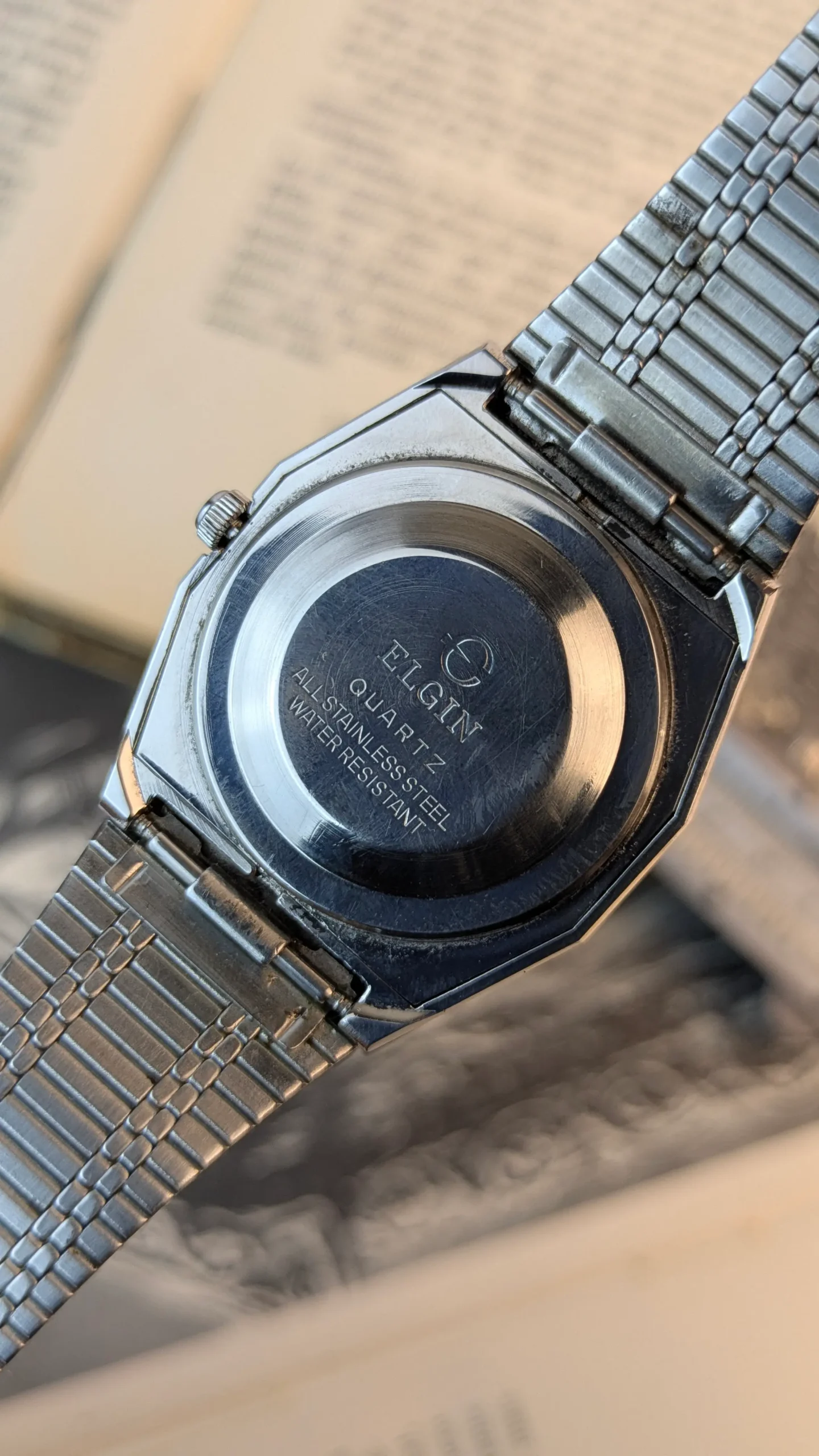 Back Stainless steel Elgin wristwatch with retro 1980s styling.