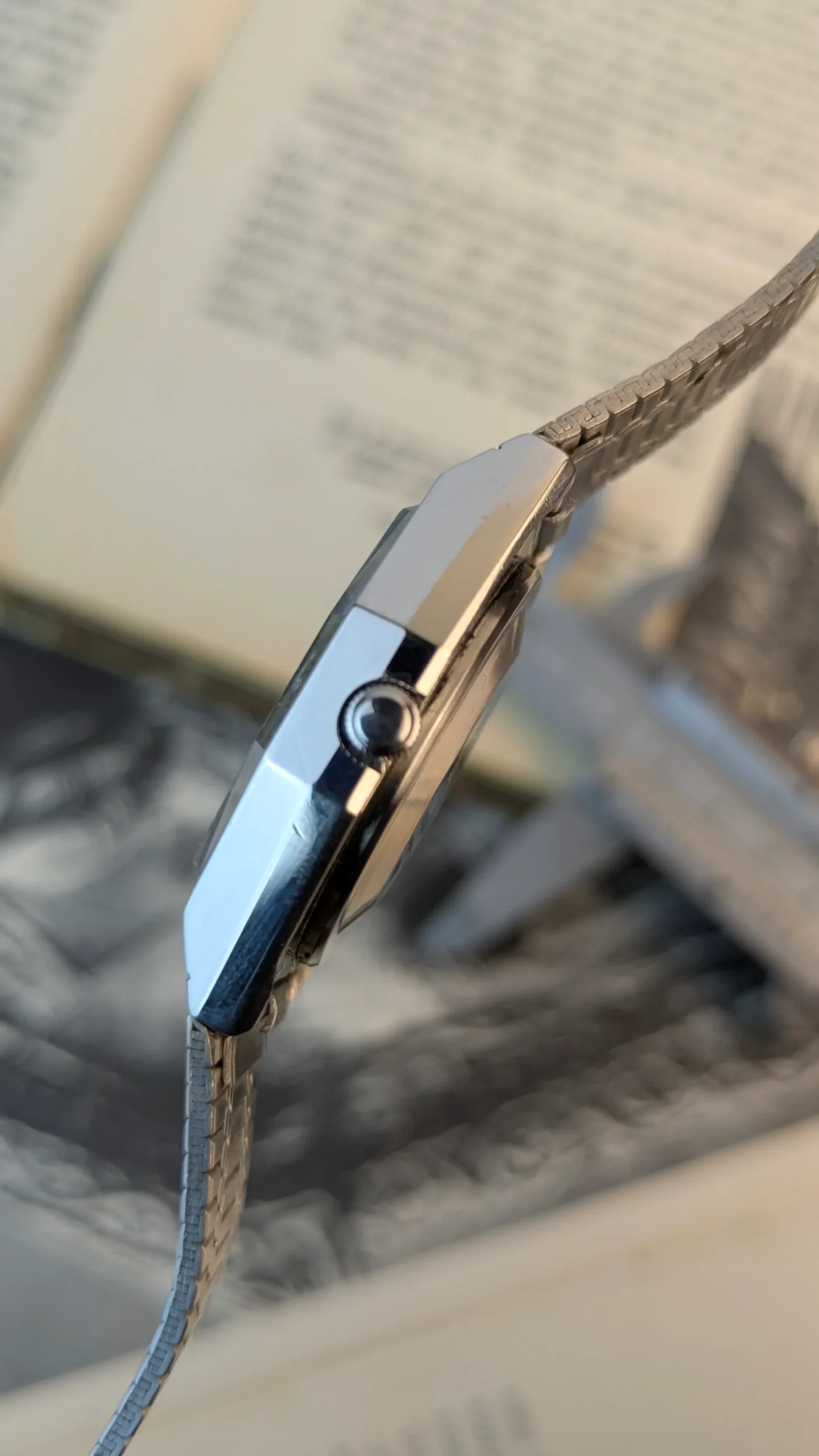 crown side of Vintage Elgin stainless steel watch with classic minimalist dial.