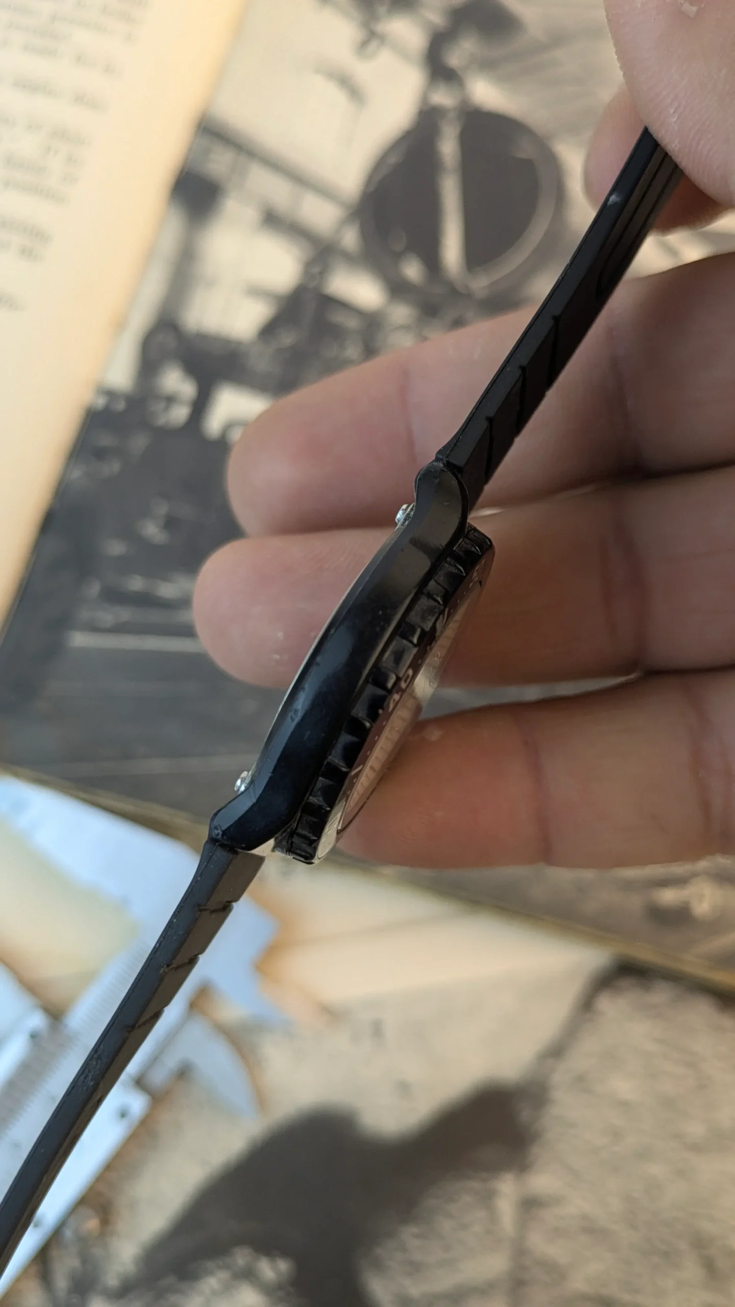 Side profile showing the slim black resin case and bezel of the Casio MRW-200H.