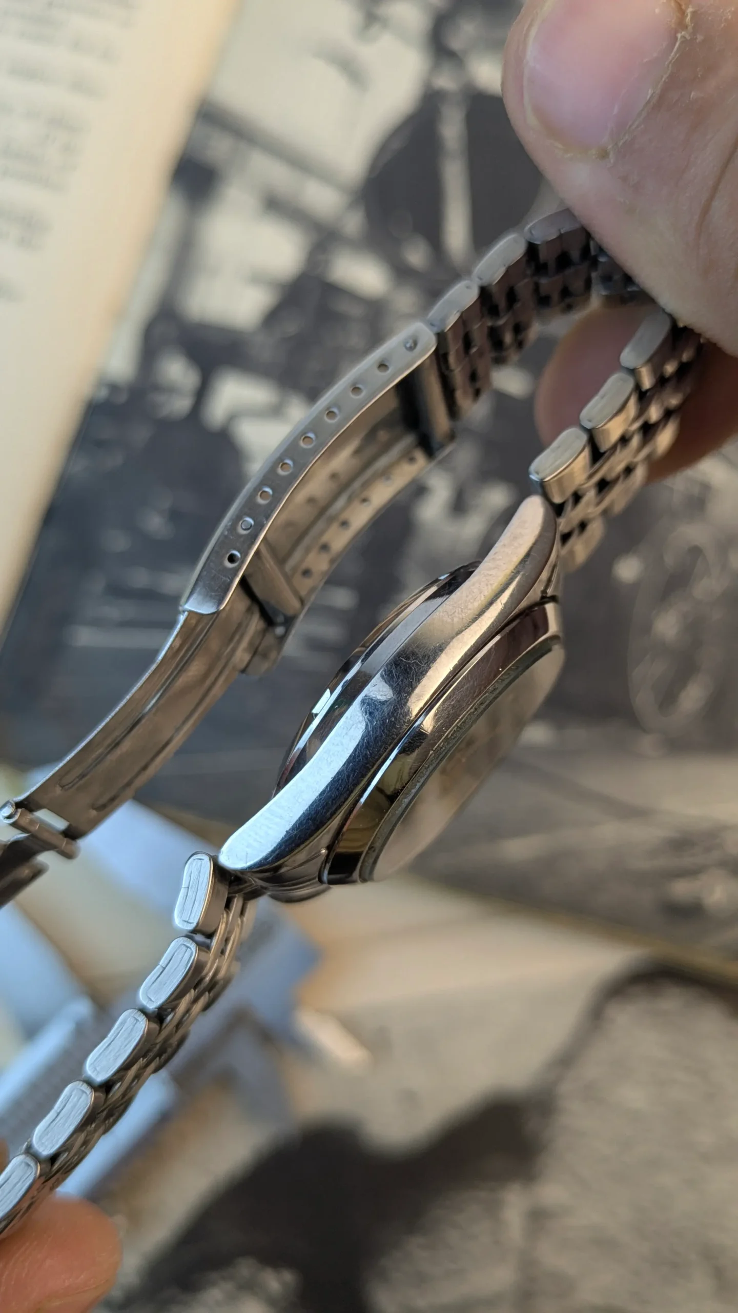 Side profile view of vintage Citizen automatic watch showing case thickness and bracelet.
