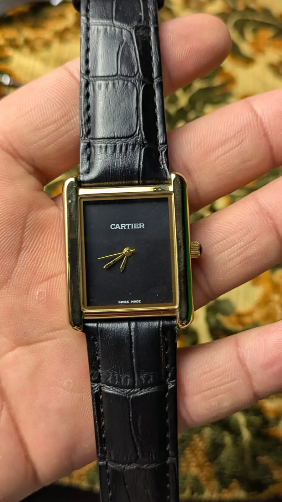 Cartier full black dial gold frame watch with Japanese movement and black leather strap front view